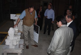 Joe Alonzo, head mason at the National Cathedral, discusses cathedral components as attendees look on.