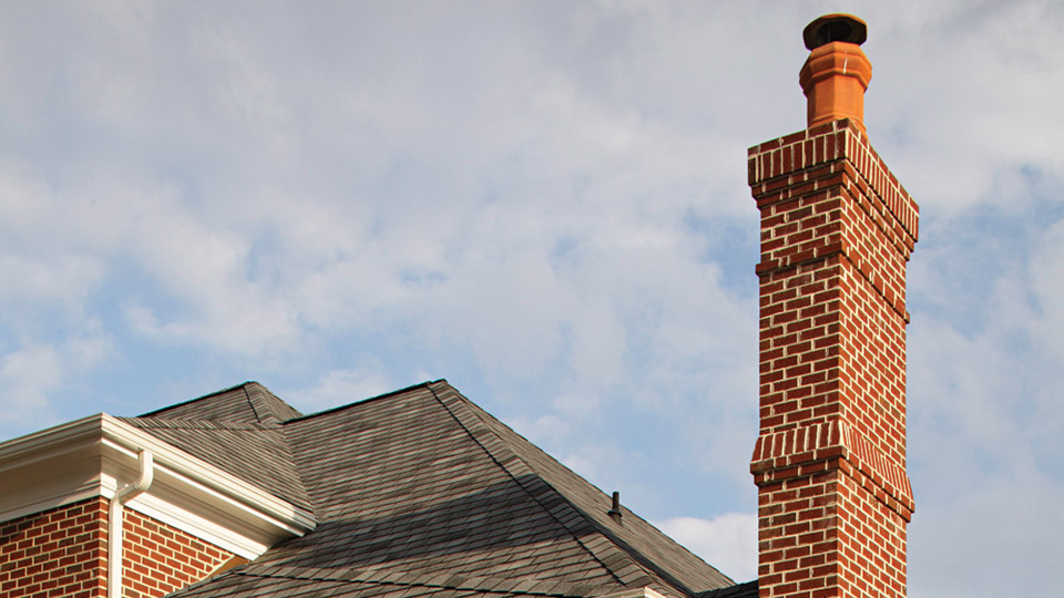 For maximum weather resistance, a chimney cap should extend beyond the chimney walls and incorporate a drip feature at its edge.
