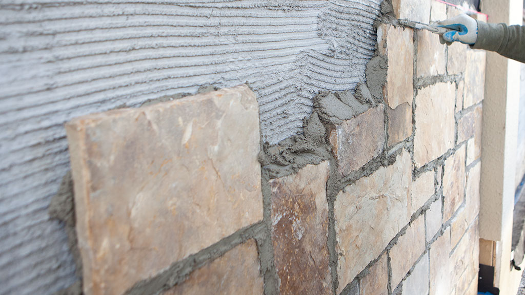 SPEC MIX Polymer Modified Adhered Veneer Mortar for superior shear bond strength.