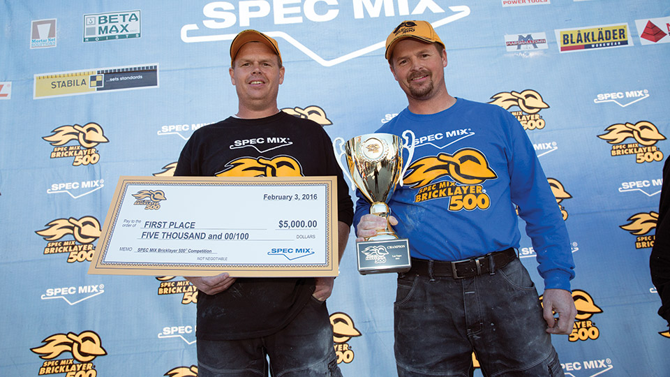 Left to right: mason tender Brian Tuttle and his brother, mason Scott Tuttle, on the winner’s stand.