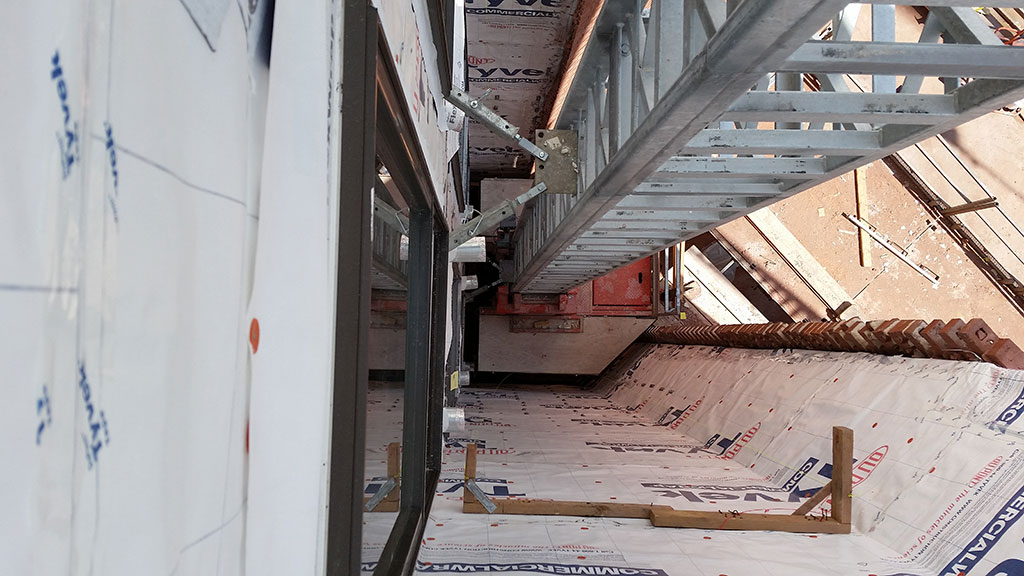 EZ Scaffold provided wedge decks to fit the wall dimensions of the alcove.